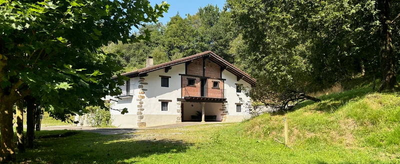 The house among the trees, river-side